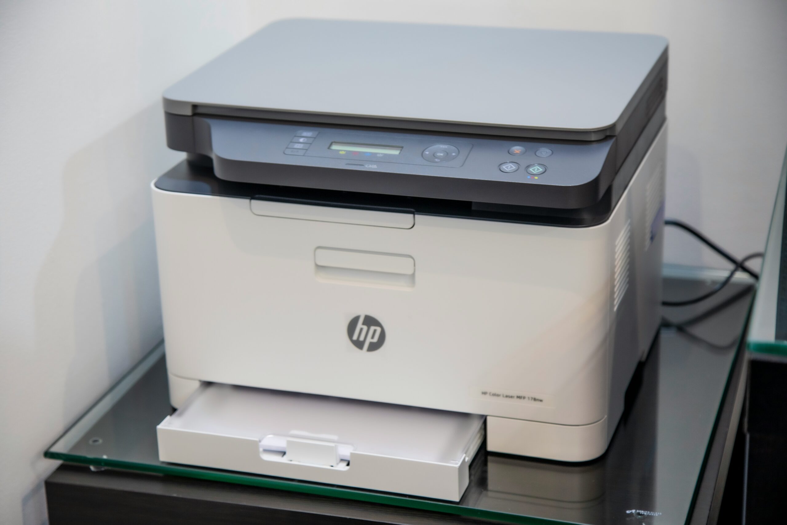 HP printer on top of table HP printer on top of table
