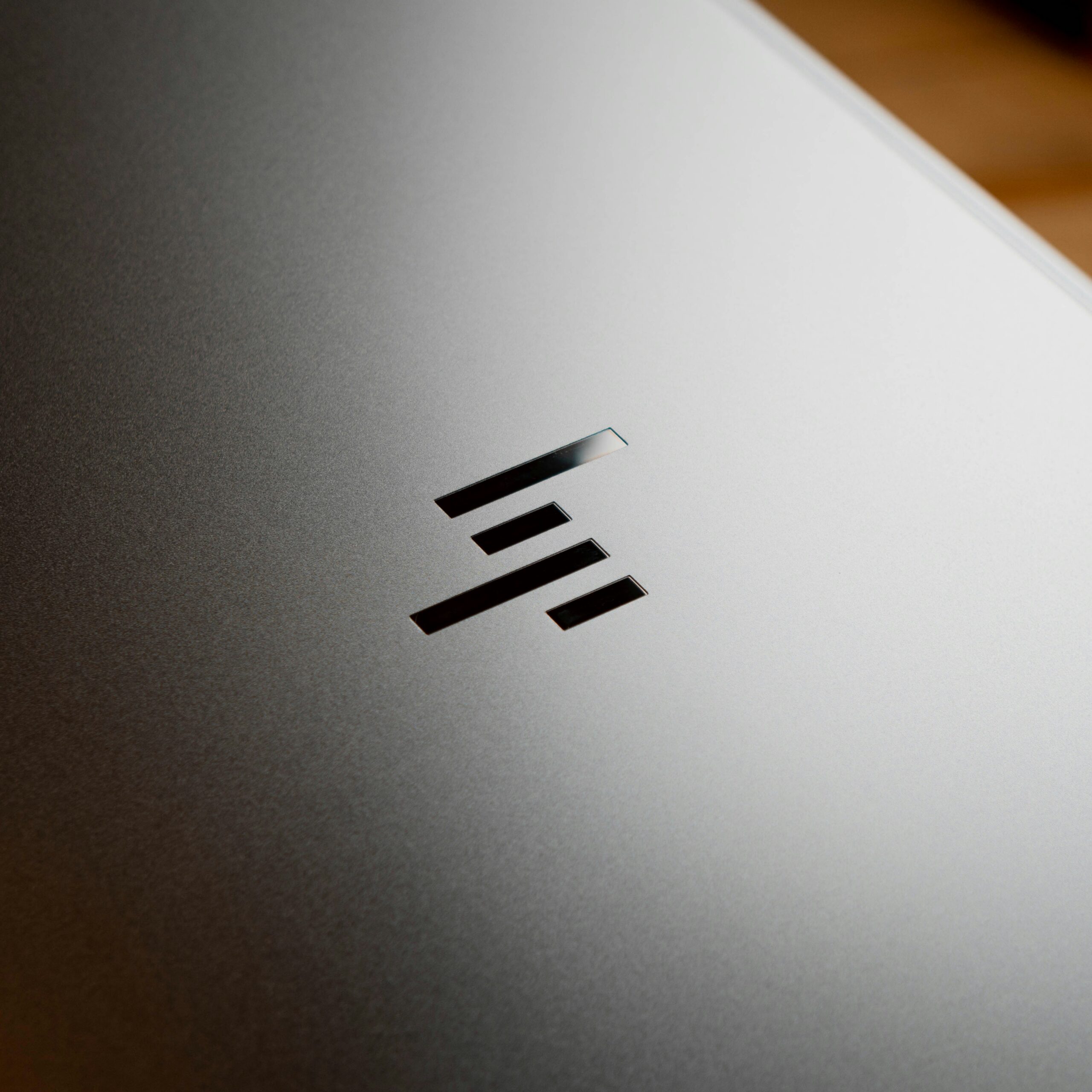 Close up shot of HP laptop's logo Close up shot of HP laptop's logo